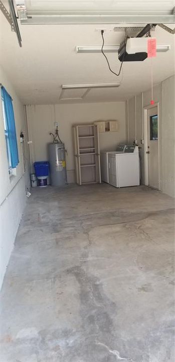 garage interior with brand new washer, dryer