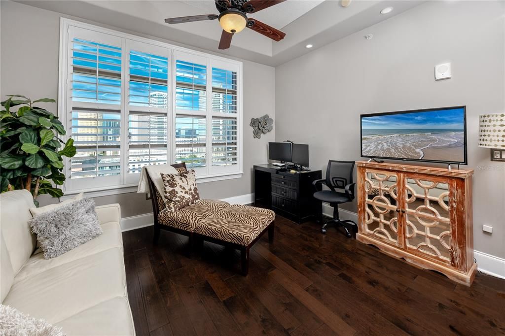 Guest bedroom with large windows