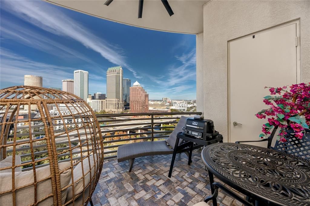 Outside patio has paver floors, new ceiling fan, and outdoor storage plus awesome views of the River & Downtown Tampa.