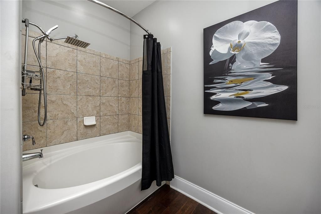 Large sunken tub/shower combo in the guest bathroom