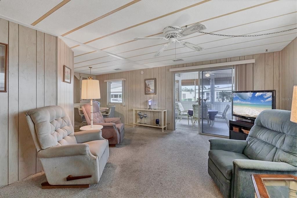 Living Room open to Lanai with glass windows