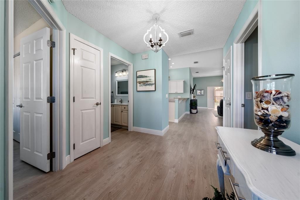 Beautiful grey-tone wood-look LUXURY VINYL flooring extends throughout the home!