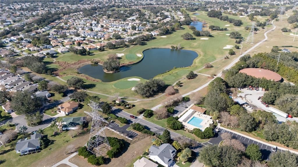 Arial view showing community pool, golf course, and pathways nearby. Mailboxes located right of parking lot.