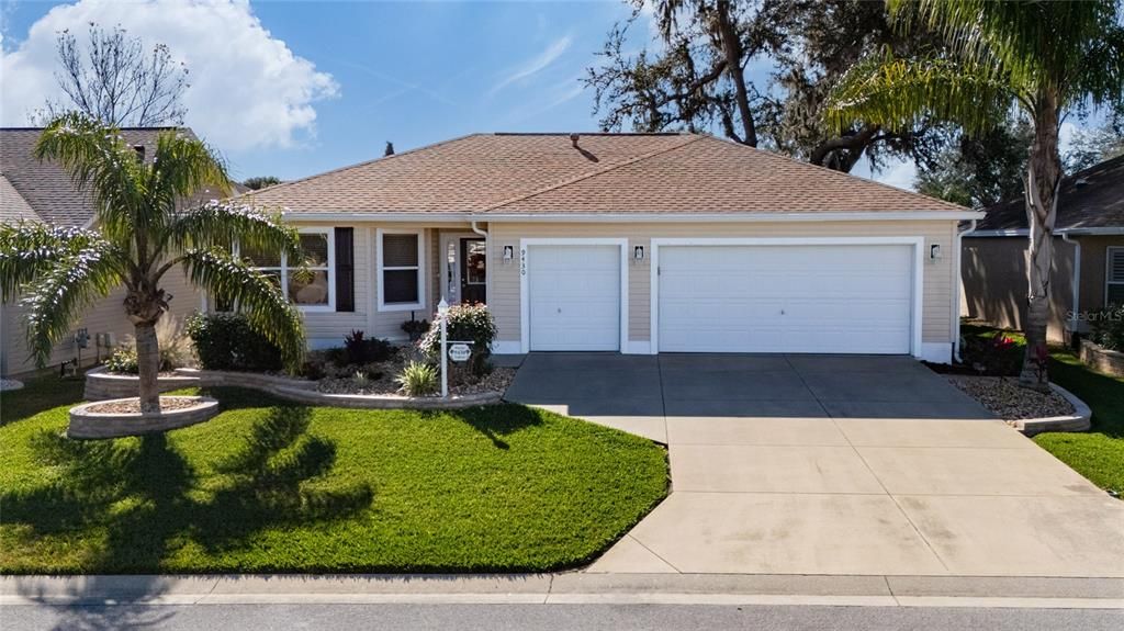 This beautiful home boasts curb appeal with hardscaping surrounding the home!