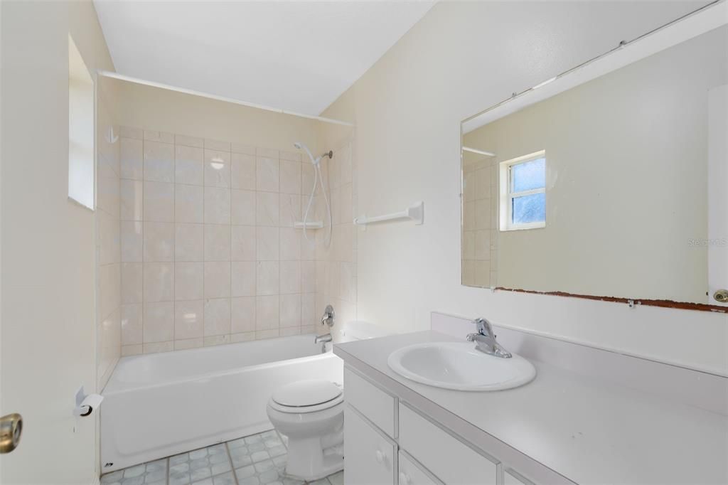 The primary en suite bath includes a tub/shower combination.