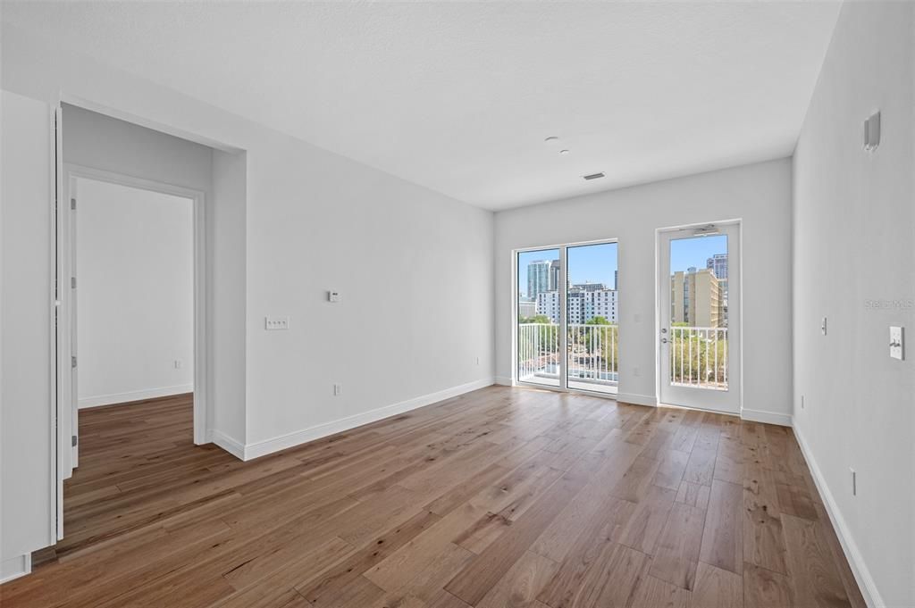 Living area - 10ft. ceilings and 8ft. windows