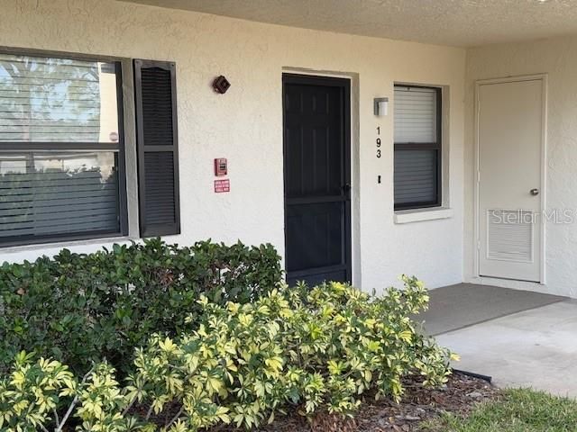 Front door with Storage room to the right