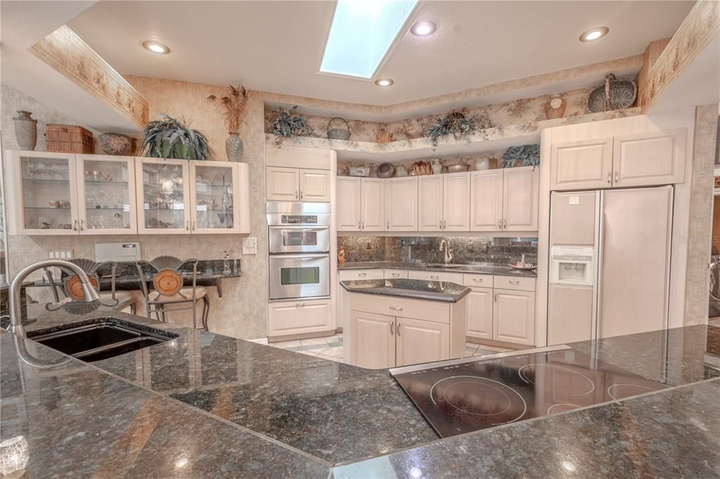 There is an abundance of counter space in the kitchen, ideal for meal prep.