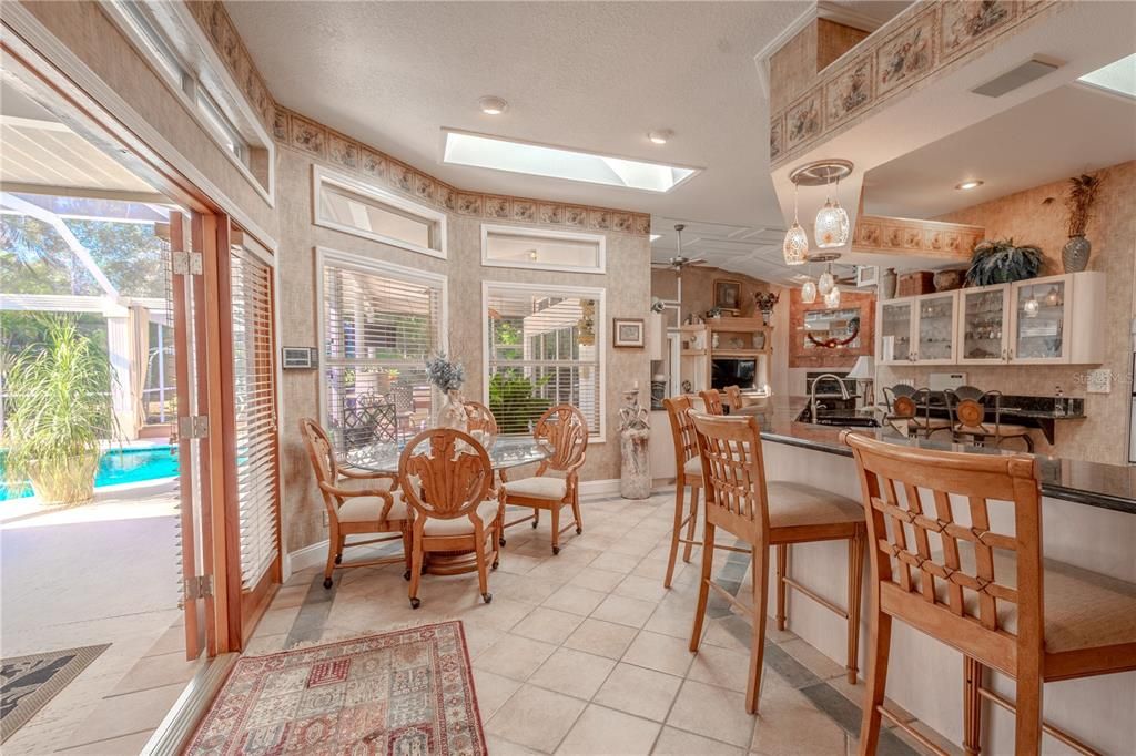 There's a cozy breakfast nook with a pool view.