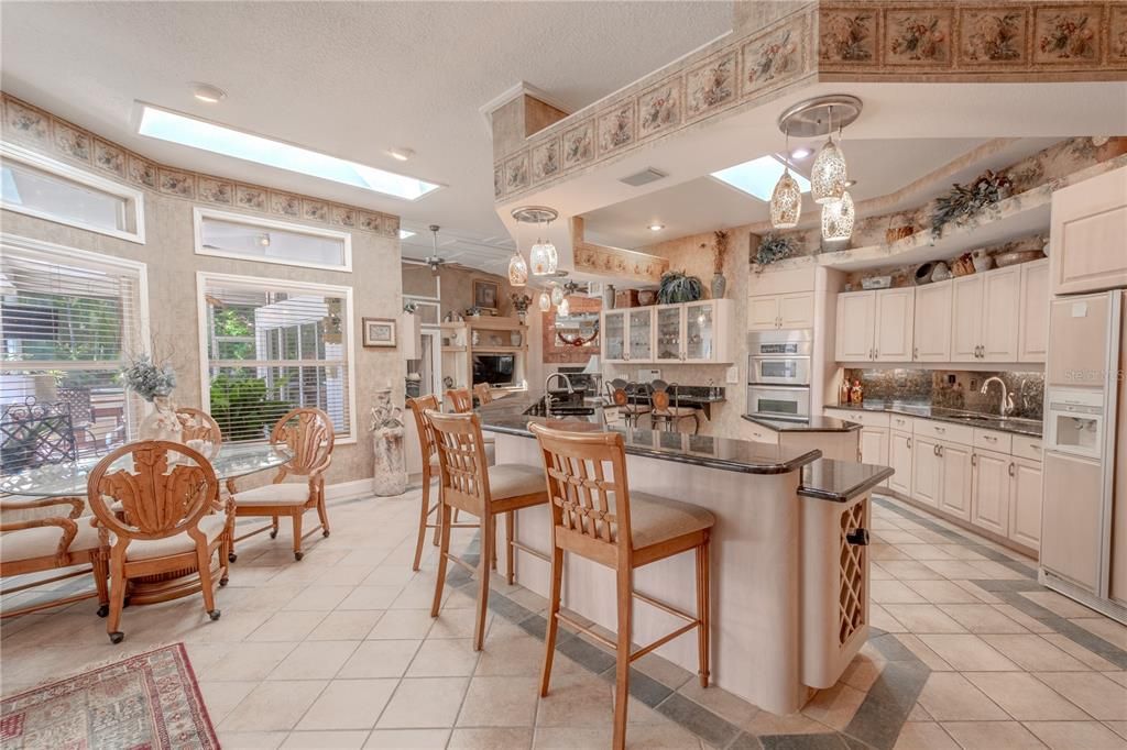 The kitchen is open to the pool and the family room.