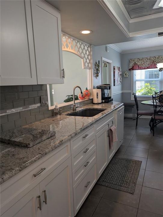 Kitchen also features stainless undermount sink with pot filler faucet, disposal and Maytag dishwasher.  To left of eat-in dinette is the Bonus room.