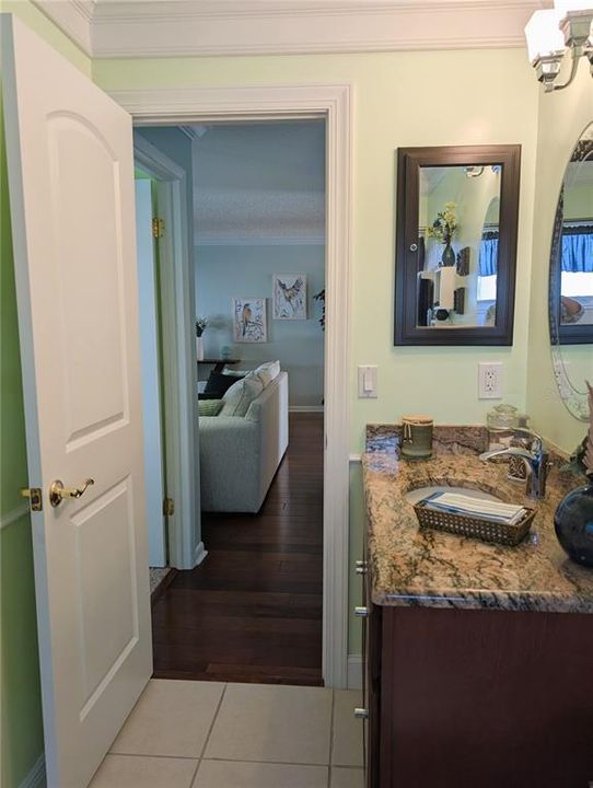 View into living area.  Guest bedroom is immediately to the left as you exit the Main bath providing guests a semi-private suite of their own.