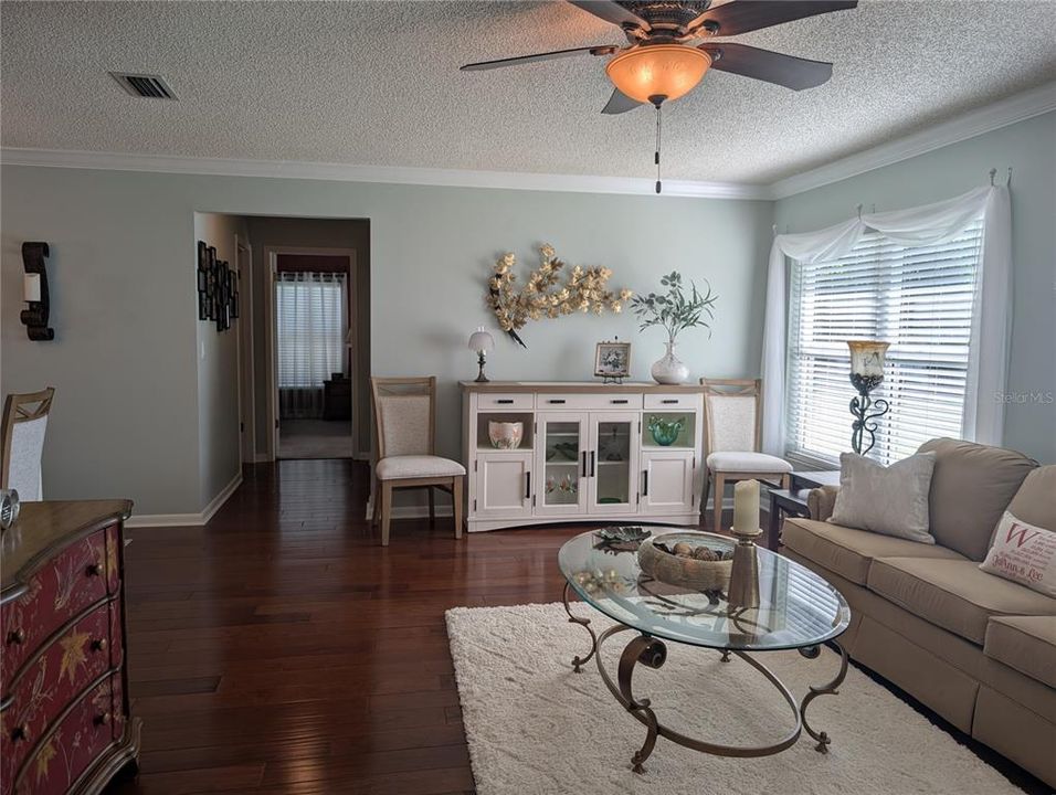 Gorgeous Anderson South Vista wood flooring (sand dune) carries throughout the living area.