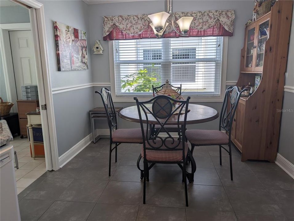 Dinette explodes with great natural light.  Bonus room entry is on left.