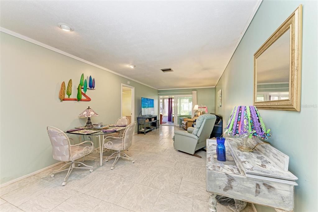 Living and dining area towards the enclosed porch