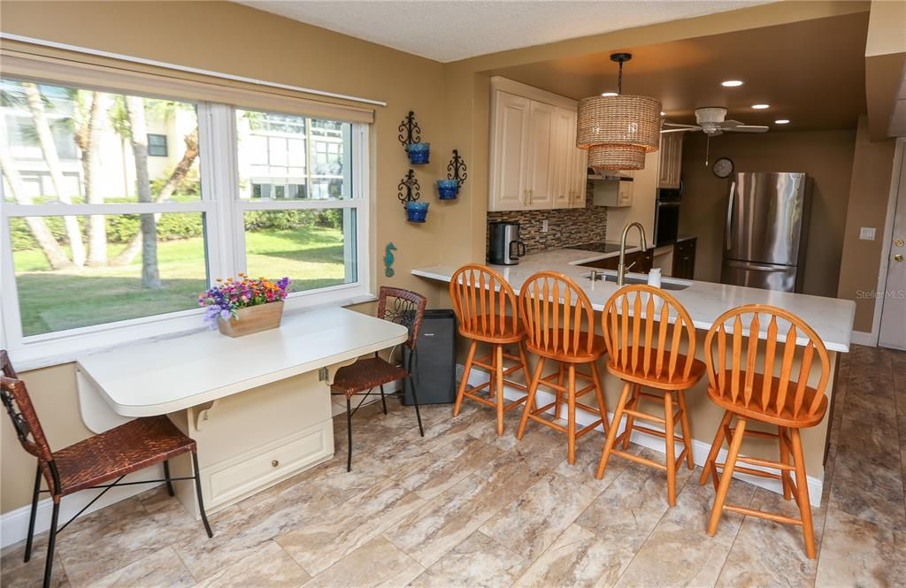 Kitchen overlooks into the dining area.