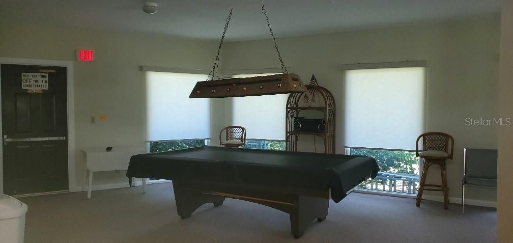 Entertainment room with pool table and games