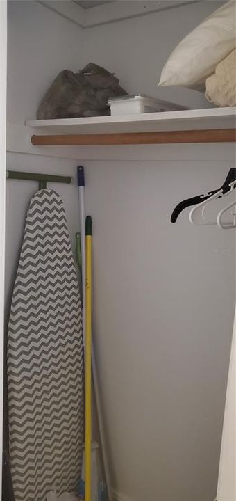 hall closet in master bedroom