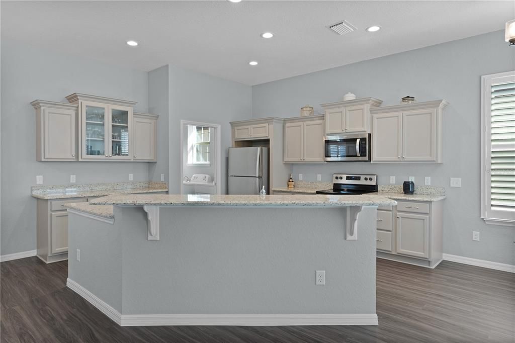 LOOKING INTO KITCHEN FROM LIVING ROOM