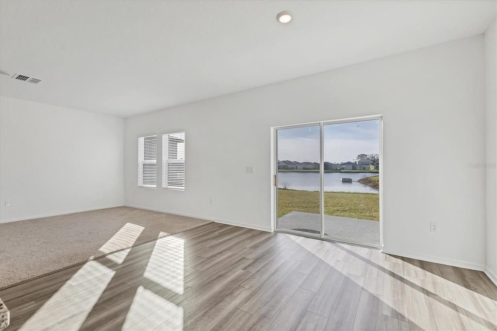 Dining Area with Sliders to Backyard and Pond