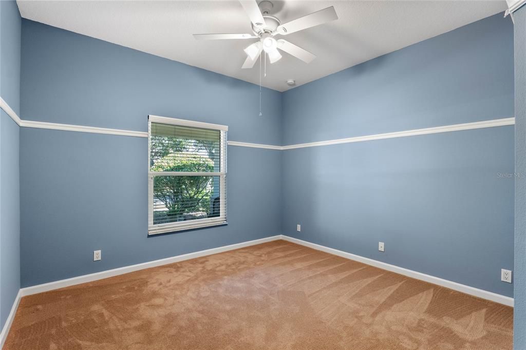 12' x 11' Bedroom #2 w/ wall molding & a ceiling fan