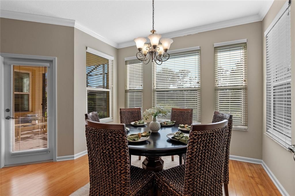 Dining Room w/ Bamboo flooring, crown molding & multiple windows for natural light