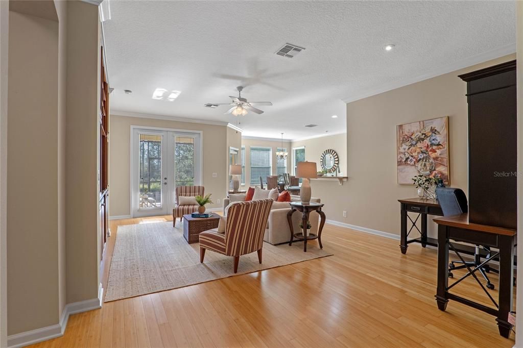 14'6" x 22'6" Great Room w/ Bamboo flooring, crown molding, recessed lighting & a ceiling fan