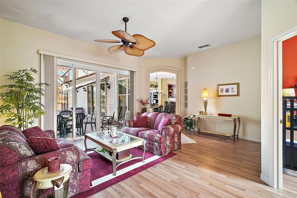 Formal Living Room. Great Views of the awesome pool area. The extra bonus room is to the right.