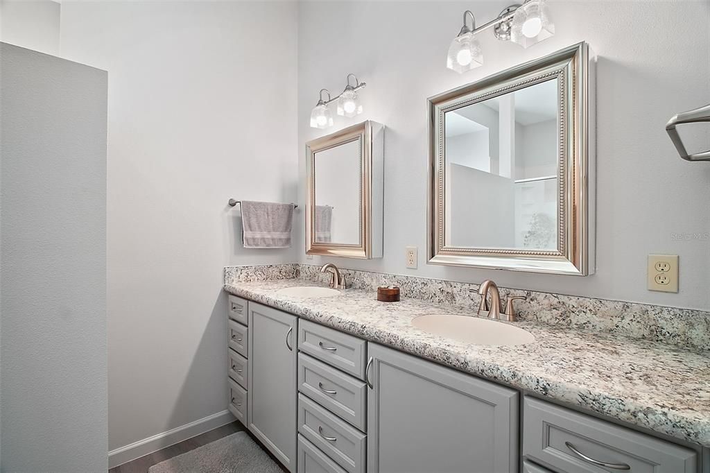 Owners Bathroom with Double sinks and plenty of storage. Walk in Shower. Totally Updated.