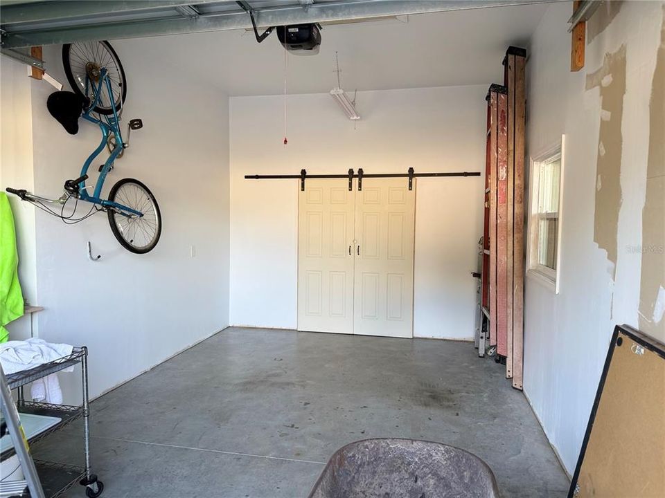 GARAGE Barndoors lead to hobby room