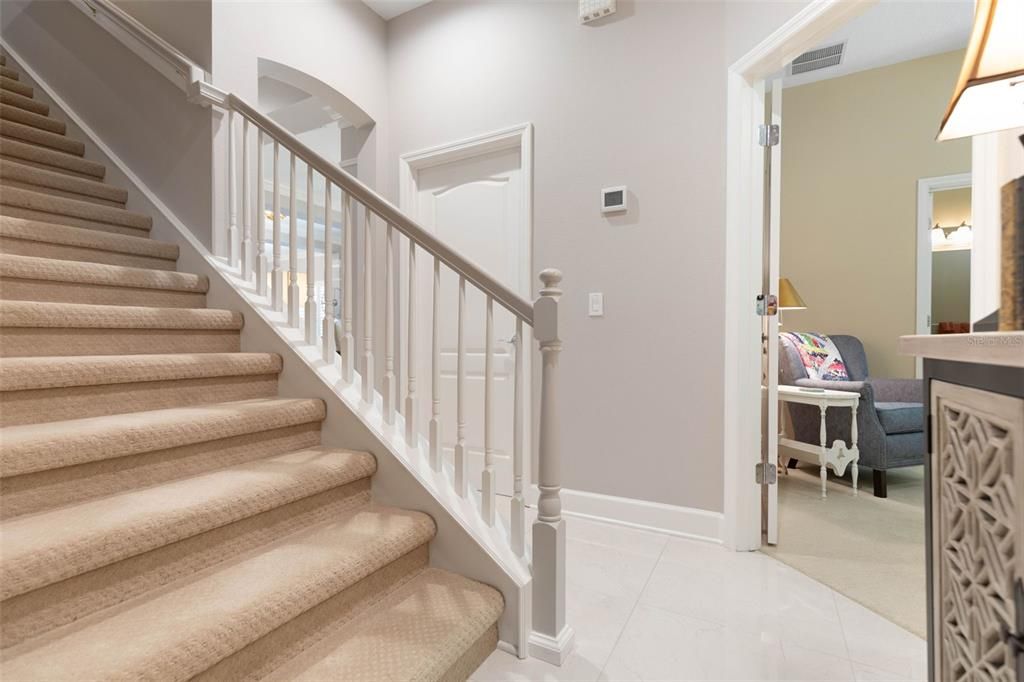 Stairs to large bonus room and full bathroom.