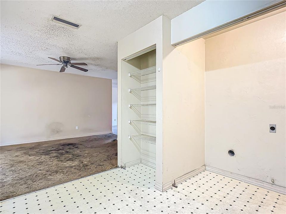 Kitchen with laundry closet visible