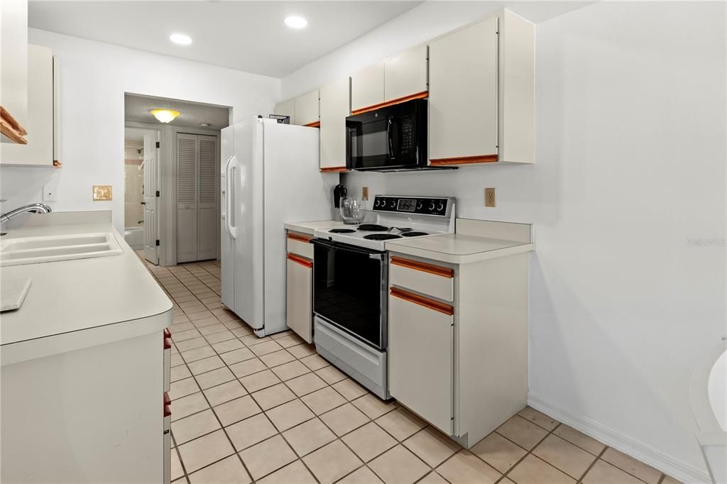 The kitchen is very spacious; room to expand cabinets and countertops or make a built-in pantry.