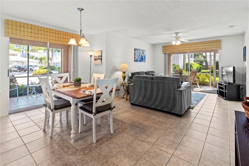 Formal dining (glass sliders to screened-in patio) and living room