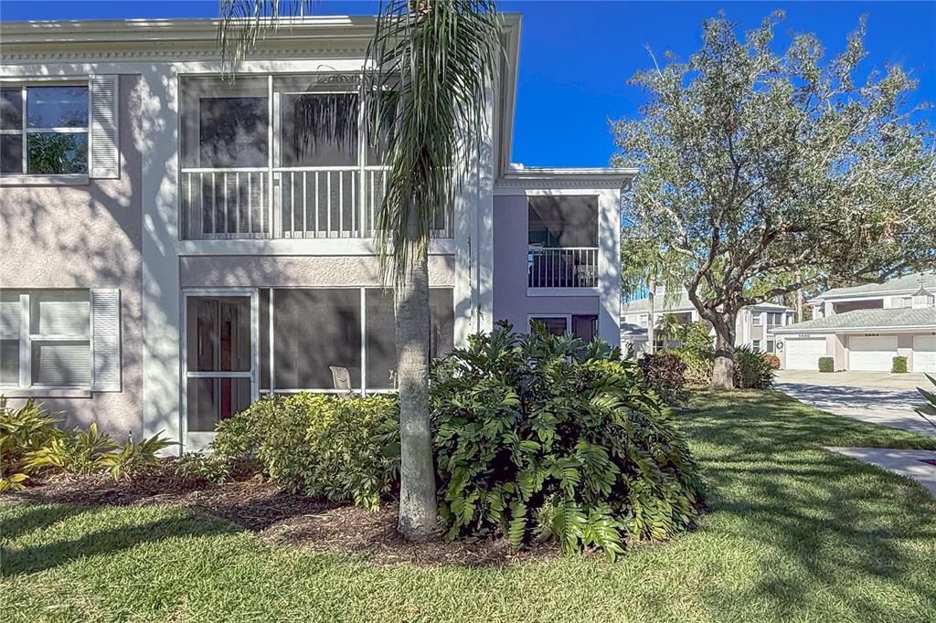 Mature landscaping surrounds the condo