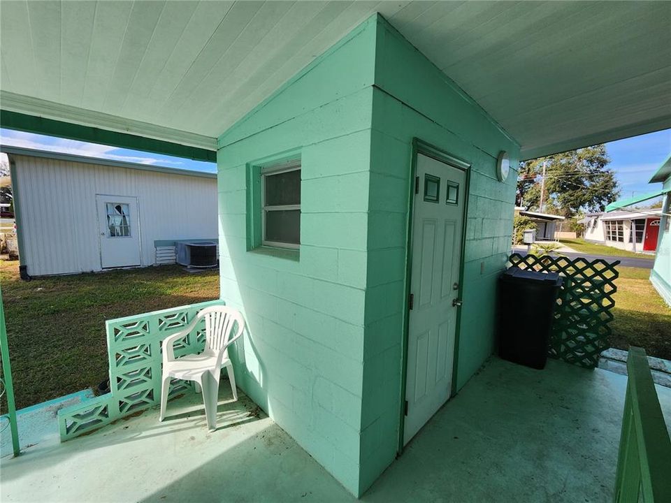 Cement block utility room.