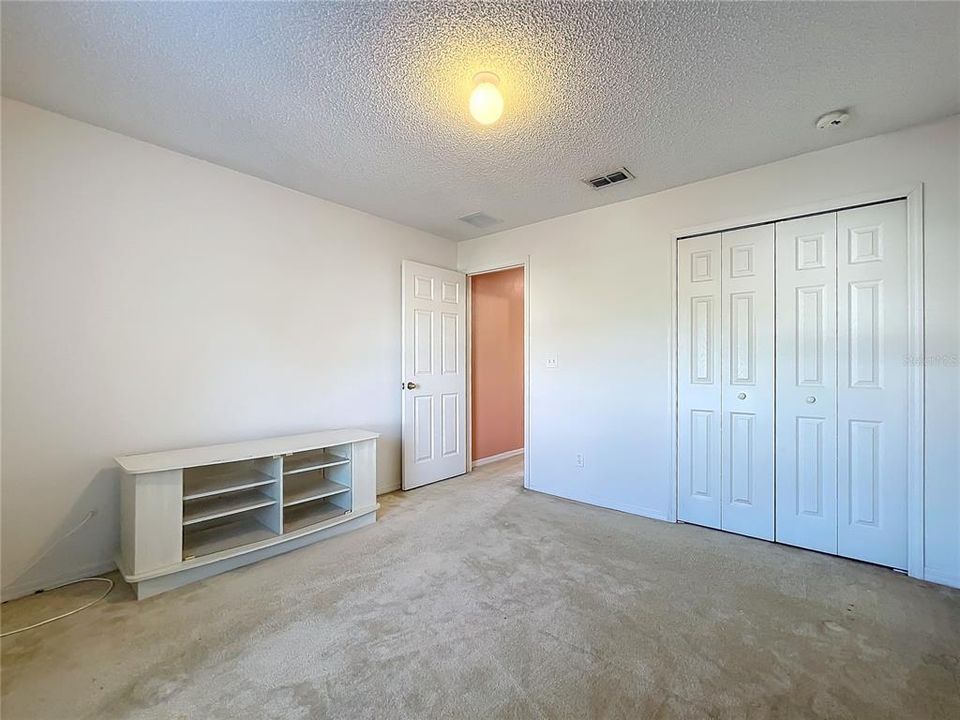 Bedroom 3 with a standard folding door closet