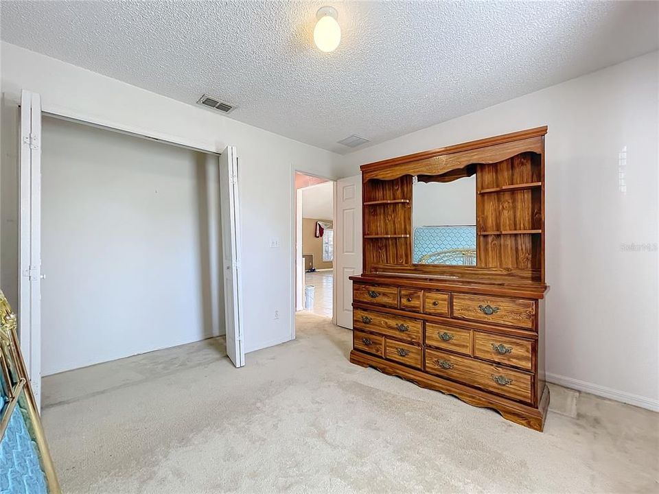 Bedroom 2 with standard folding doors closet.