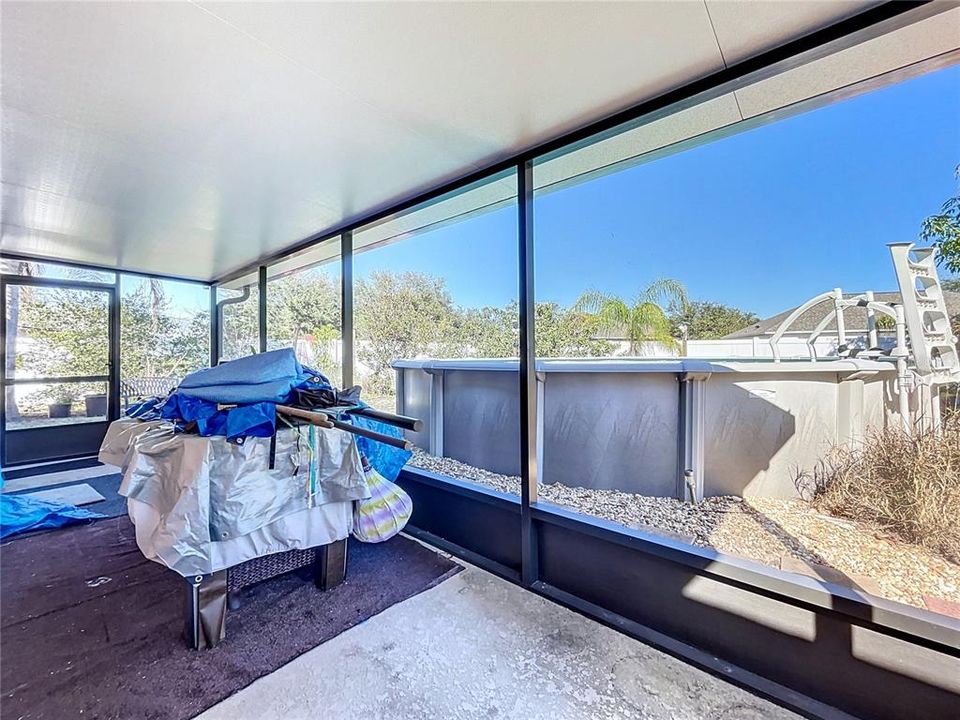 Screen porch has doors on both sides for easy access into the backyard.