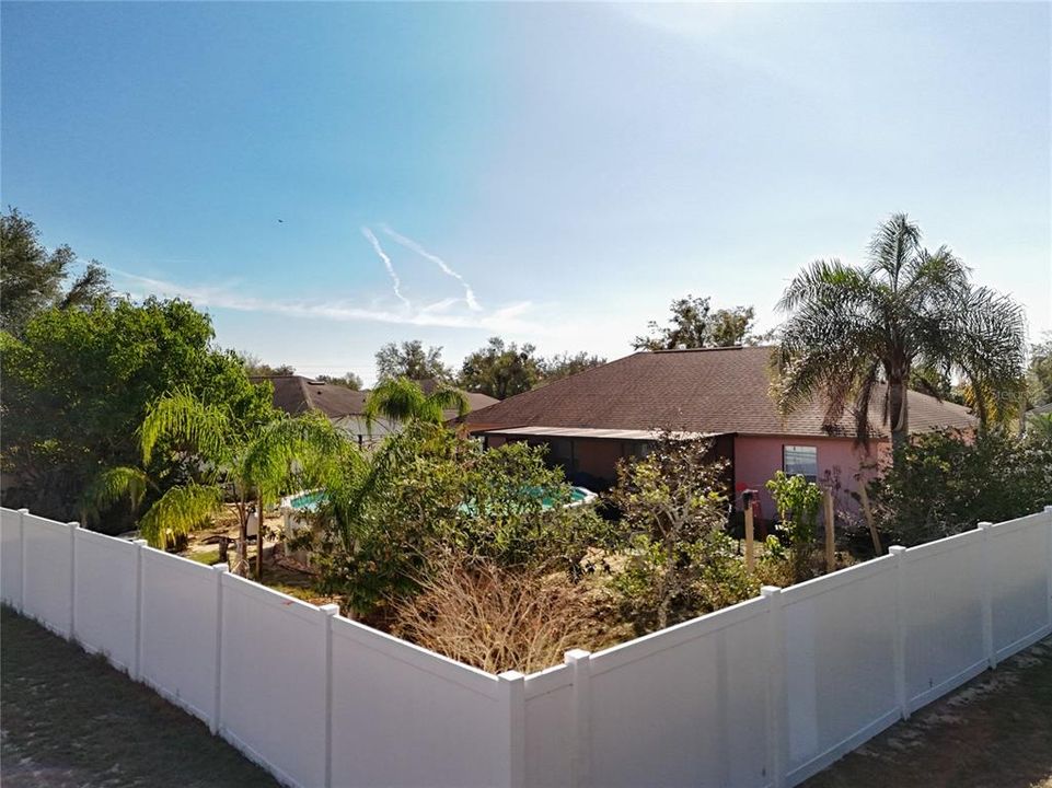 Backyard is fully fenced with vinyl fencing.