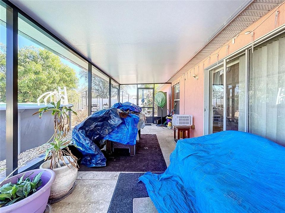 Large screened in porch overlooks the pool.