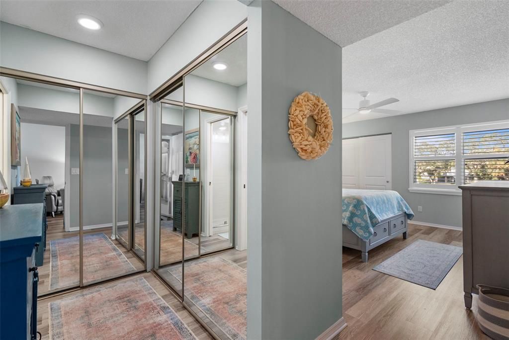 Primary bedroom hallway to primary bathroom