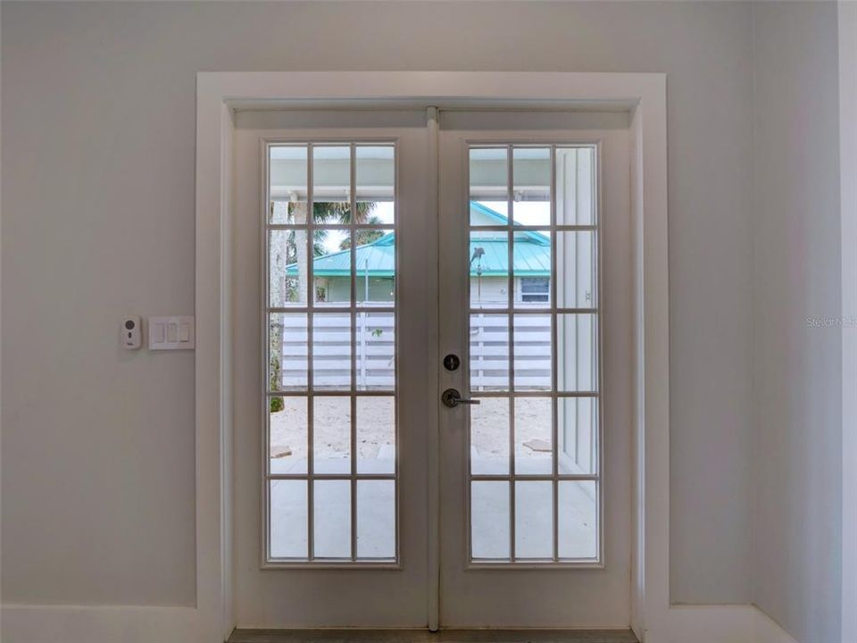 French Doors Open to Covered Back Porch