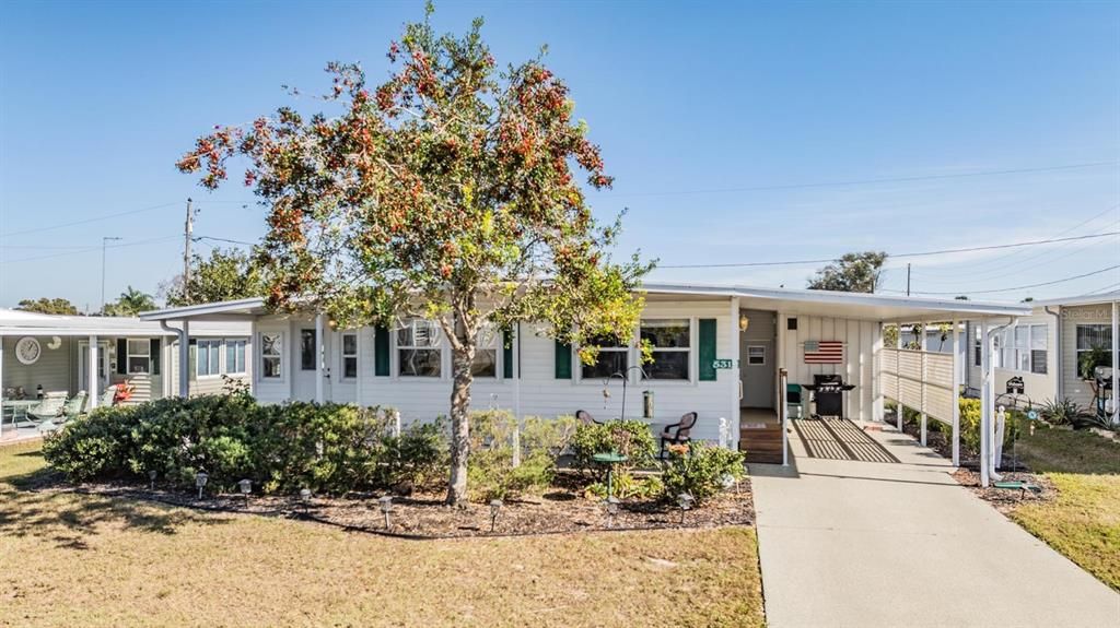 So many nice updates: including painted driveway, double pane windows, wooden kitchen cabinets, and plenty of storage.