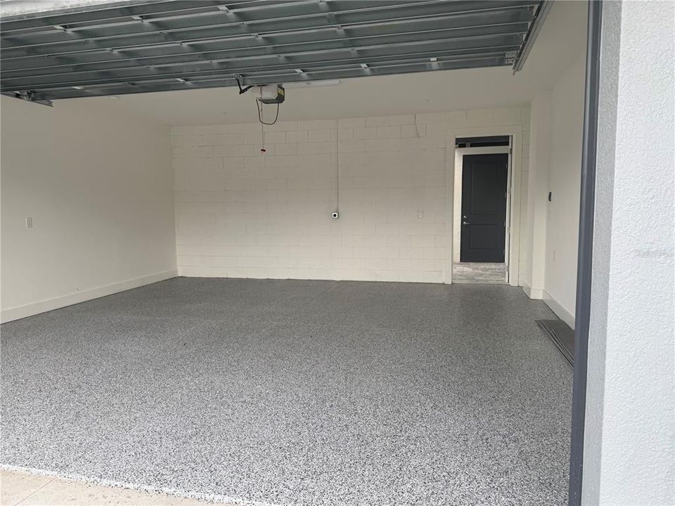 OVERSIZED 2 CAR GARAGE WITH EPOXY FLOOR COATING.