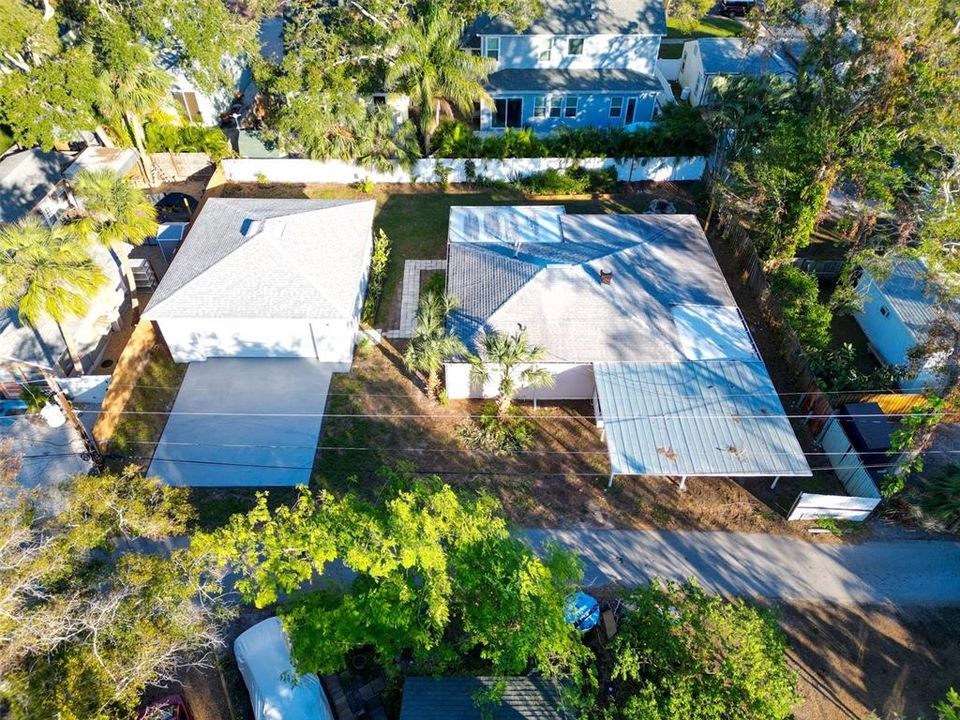 Aerial view of the house with carport and adjacent 3 car garage