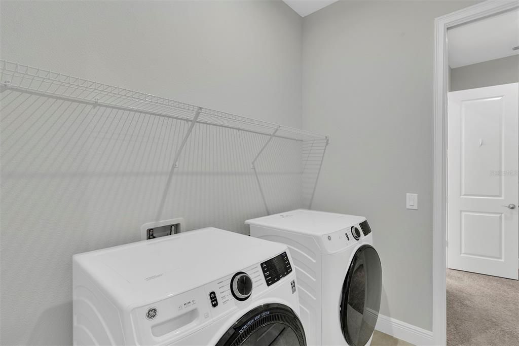 Laundry with newer washer and dryer