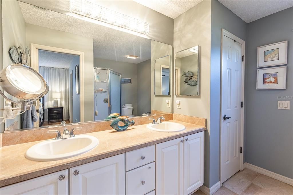 DUAL SINKS, LINEN CLOSET, CERAMIC TILE FLOORING AND WALK-IN SHOWER