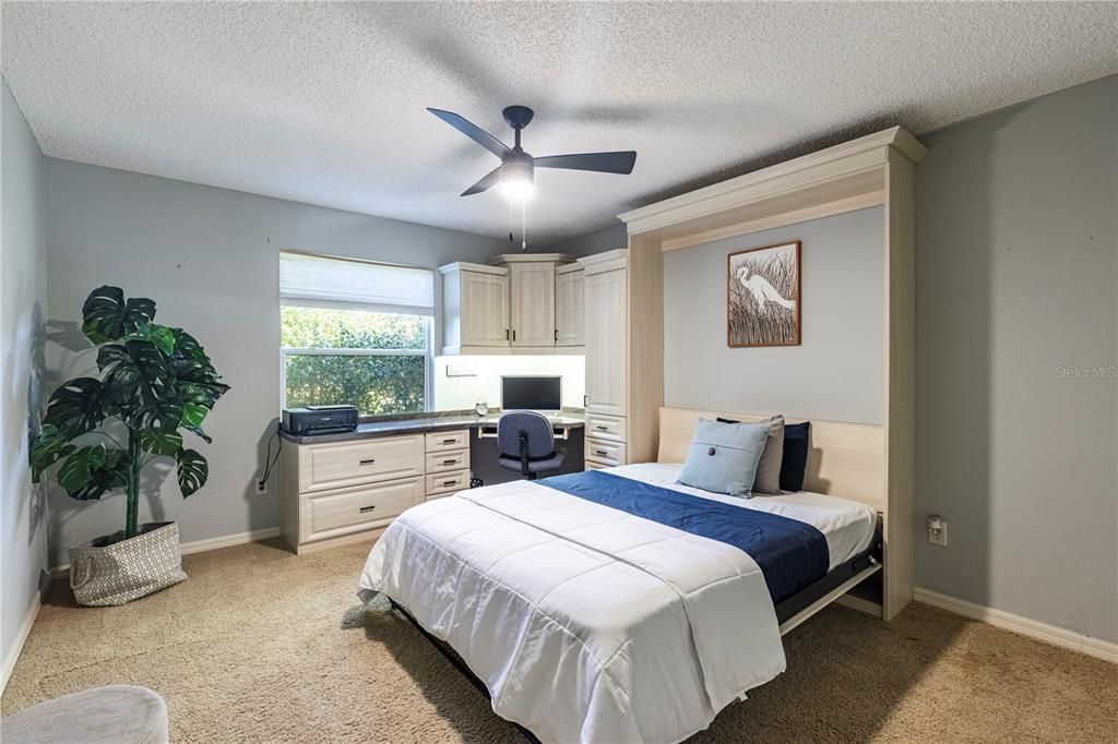 BEDROOM 2 WITH A MURPHY BED AND BUILT IN DESK