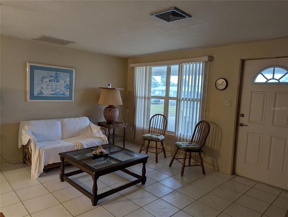 It's spacious living room with natural lighting.